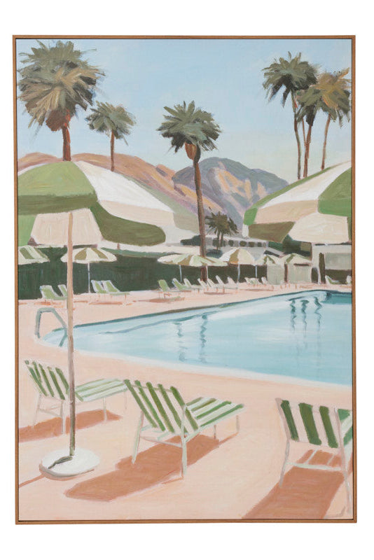 A framed art print depicting a retro-style poolside scene with palm trees, lounge chairs, striped umbrellas, and mountains in the background, shown against a plain white backdrop.