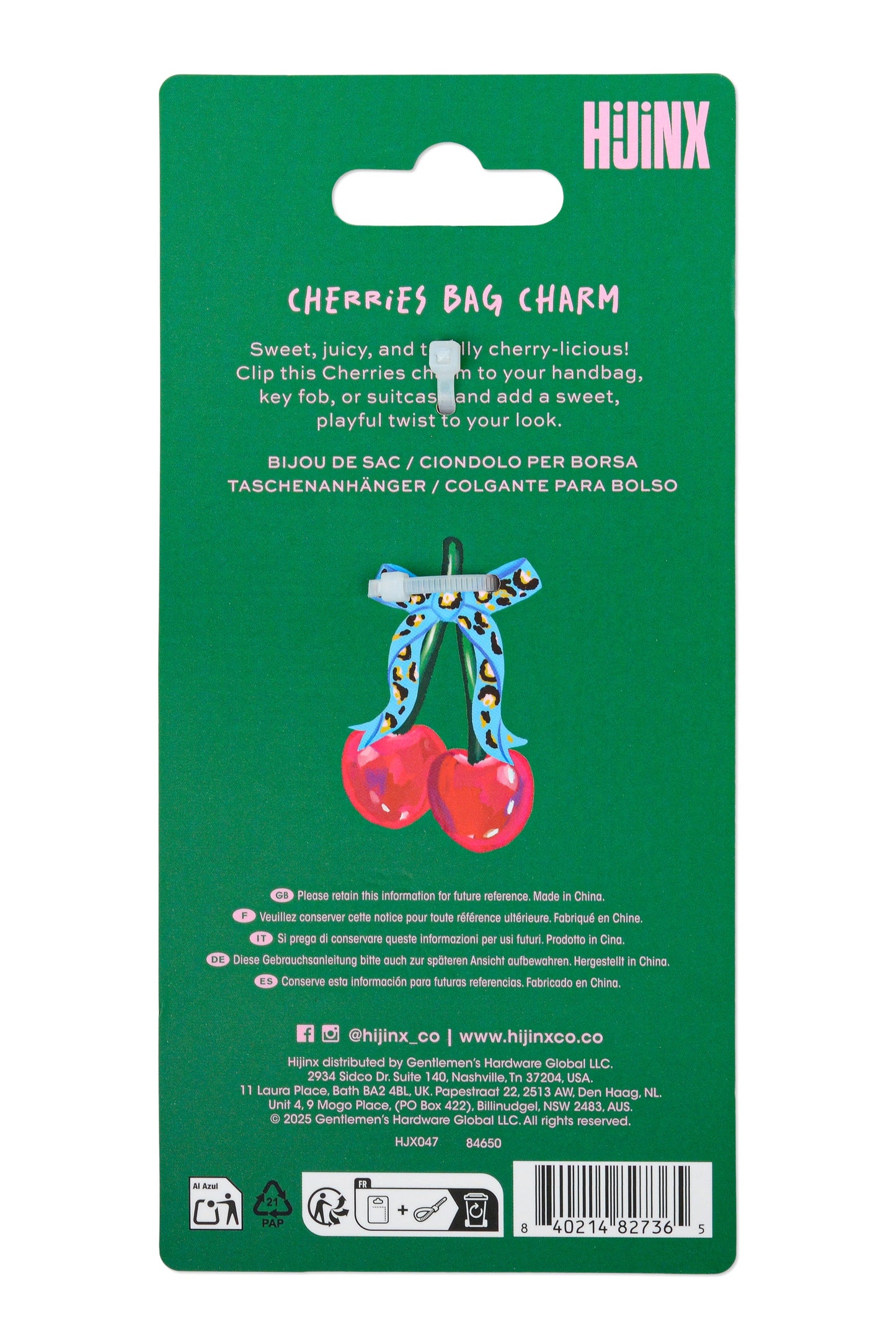 Green packaging for a cherry bag charm with text and branding.