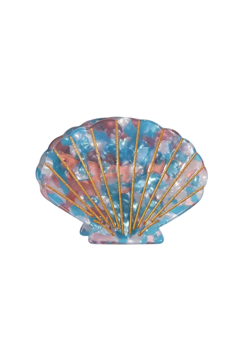 A scallop shell-shaped resin brooch with a marbled blue, pink, and white pattern, accented by gold-tone radial lines, shown on a plain white background.