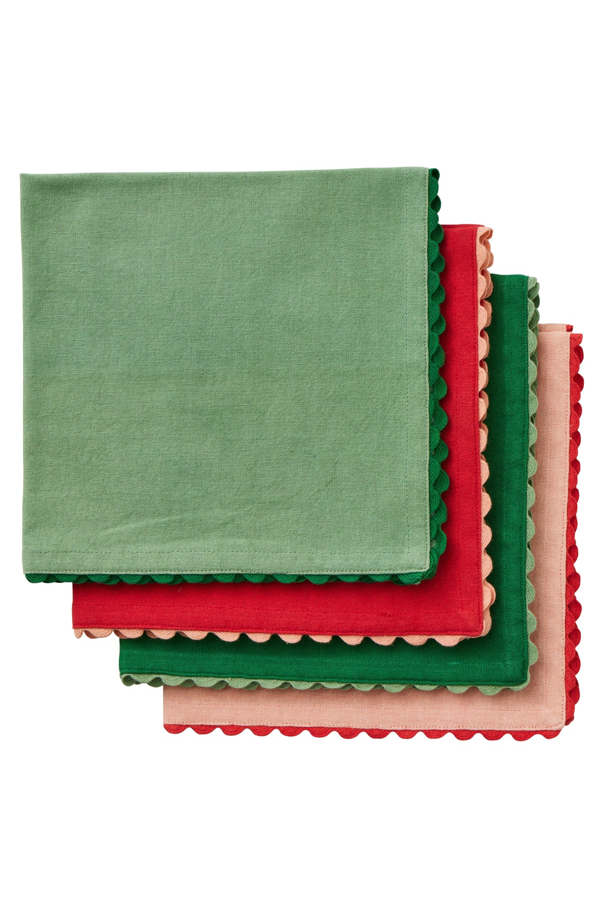 Four square fabric napkins with scalloped edges stacked in an overlapping fan arrangement. The napkins are sage green, red, forest green, and light pink, shown against a plain white background.