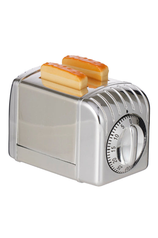 Metallic toaster egg timer with two slices of bread on a white background
