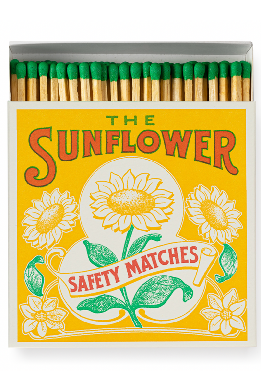 Matchbox labeled 'The Sunflower Safety Matches' with sunflower design on a yellow background