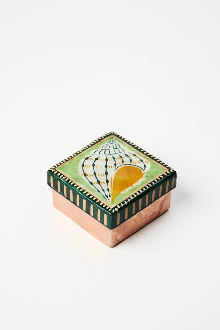 Decorative box with a shell design on a white background