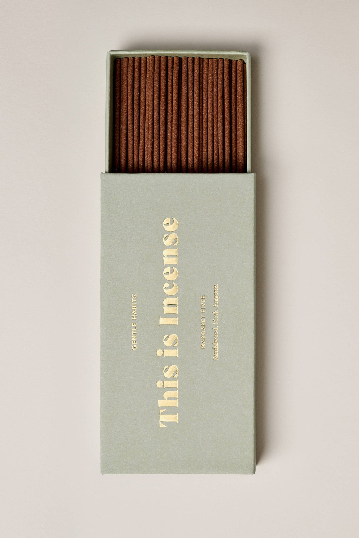 Incense sticks in a box with 'This is Incense' text on a light background