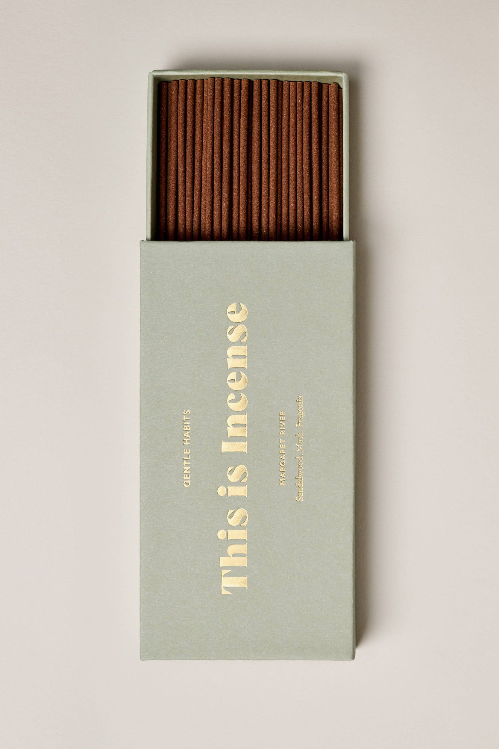 Incense sticks in a box with 'This is Incense' text on a light background