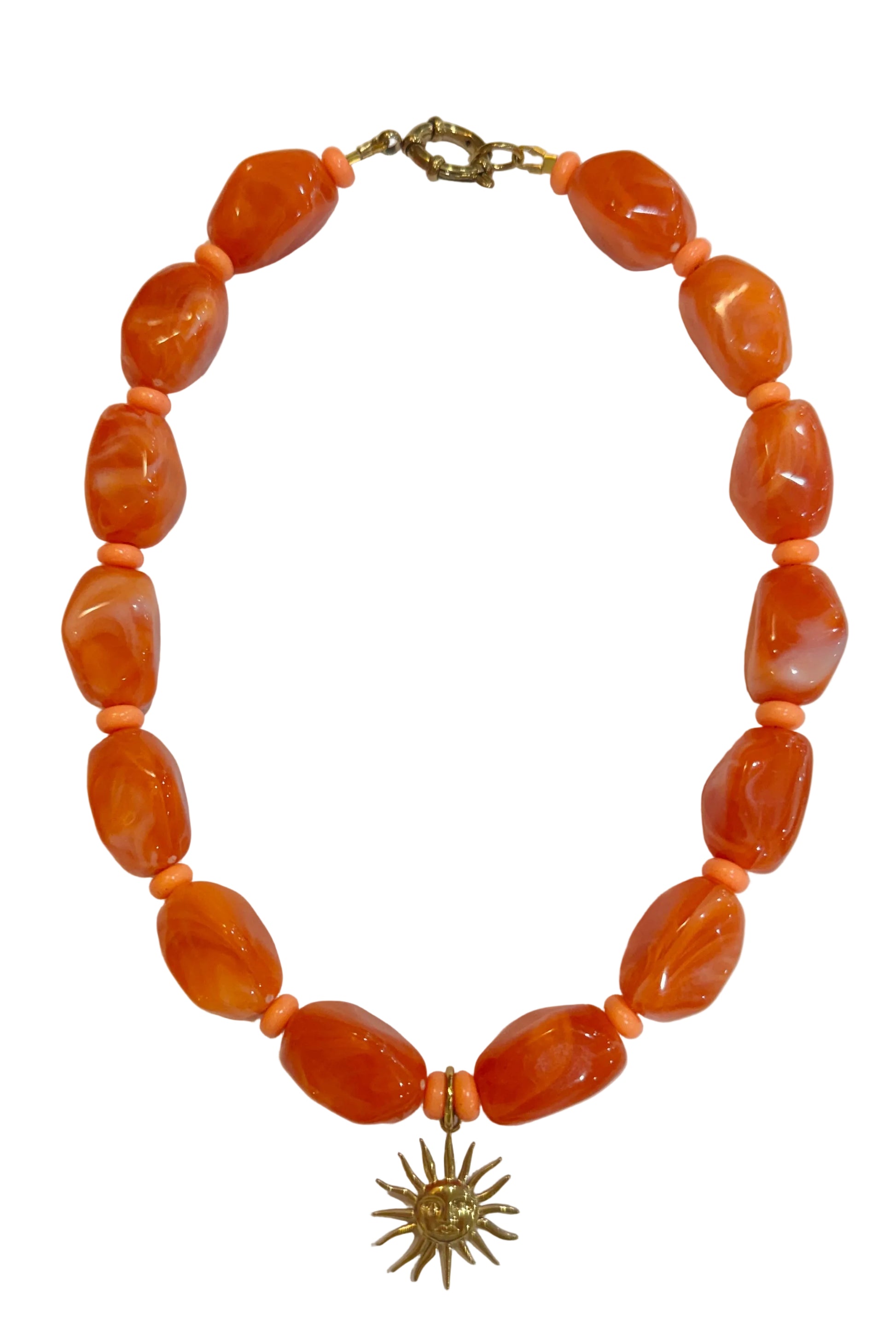 Necklace with orange beads and a gold clasp on a white background