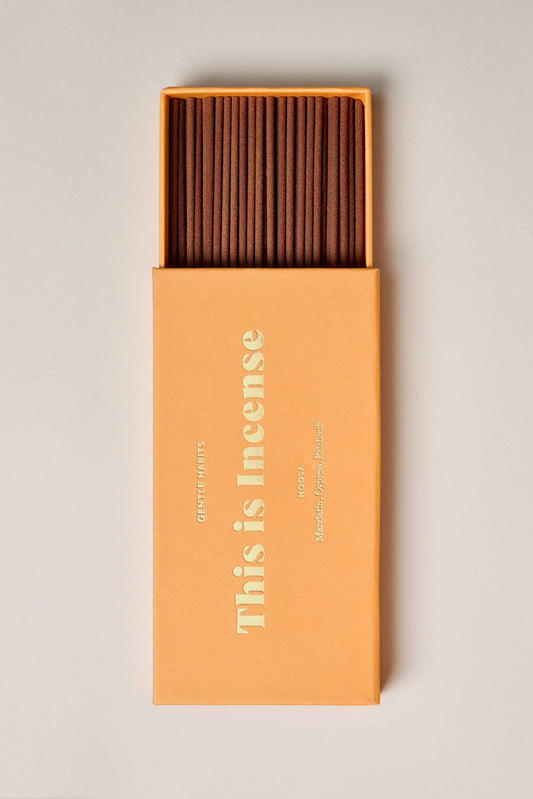 Box of incense sticks with 'This is Incense' branding on a light background