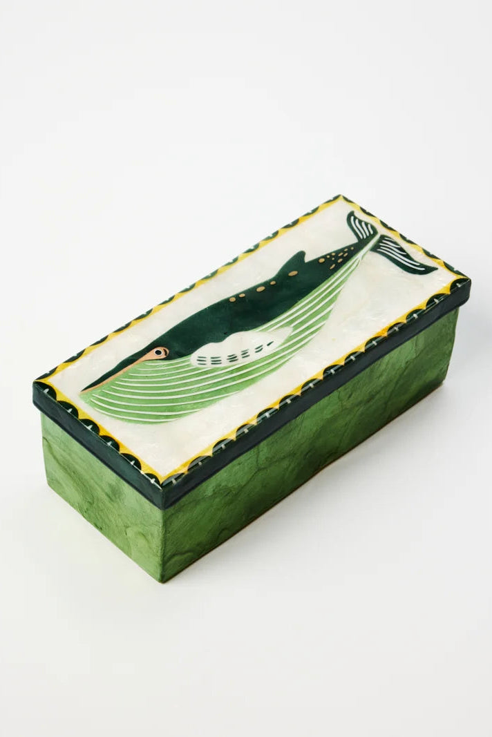 Decorative box with a whale design on a white background