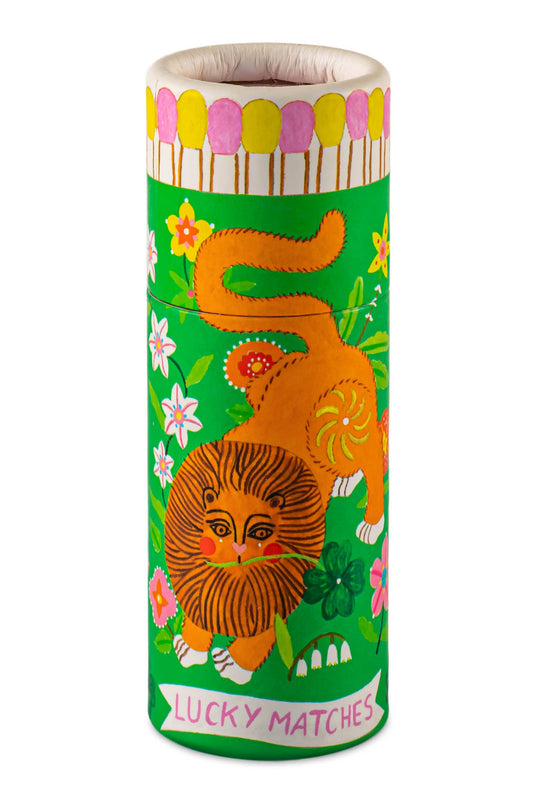 Matches canister with a lion design on a white background