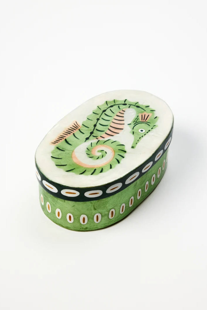 Decorative box with a green leaf design on a white background