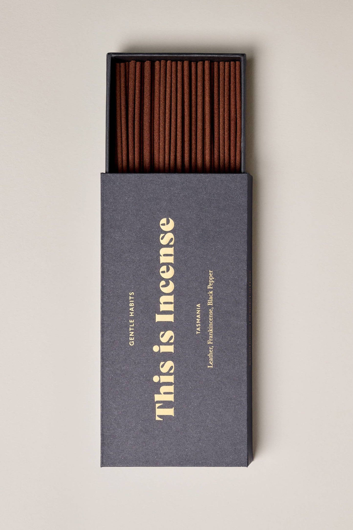 Incense sticks in a black box with 'Gentle Habits' branding on a beige background