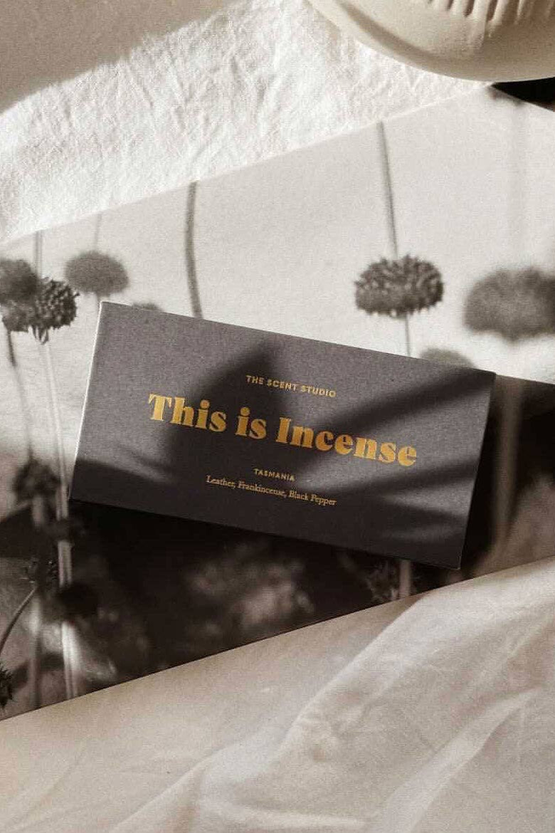 Incense packaging with 'This is incense' text on a blurred background