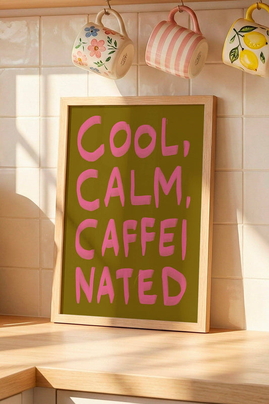 Kitchen counter with coffee maker, colorful mugs on a shelf, and a sign reading 'Cool, Calm, Caffeinated'.