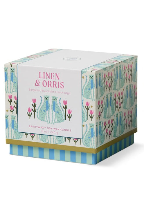 Decorative candle with a matching box featuring cat illustrations on a white background