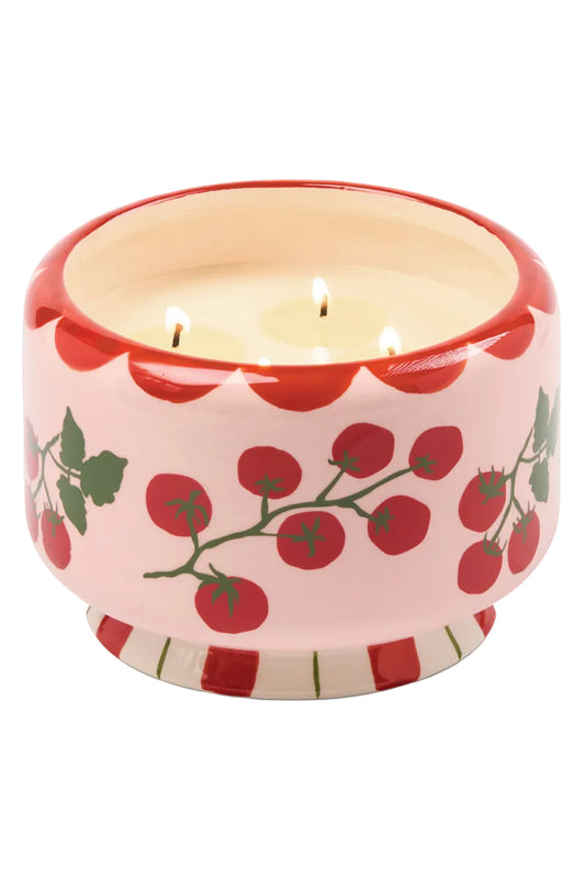 Ceramic candle holder with cherry tomato design on a white background