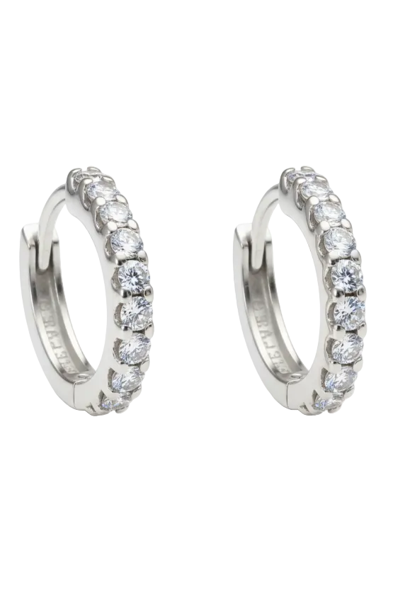 Pair of silver hoop earrings with clear gemstones on a white background