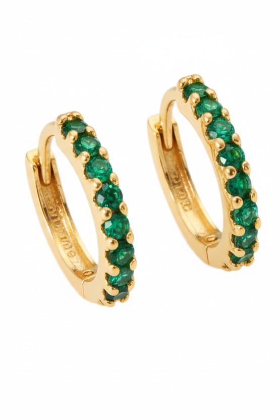 Gold hoop earrings with green gemstones on a white background