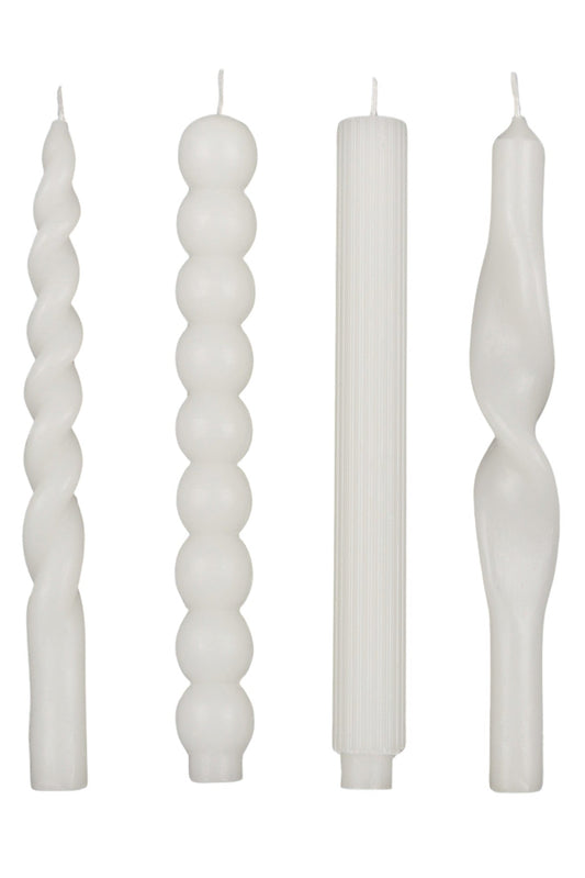 Set of four white twisted candles on a white background