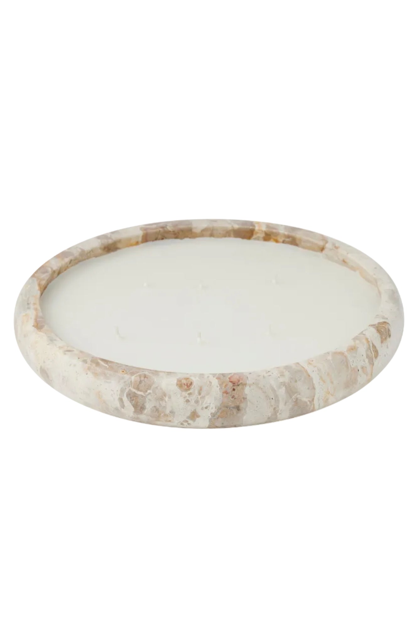 Beige marble candle filled bowl with on a white background
