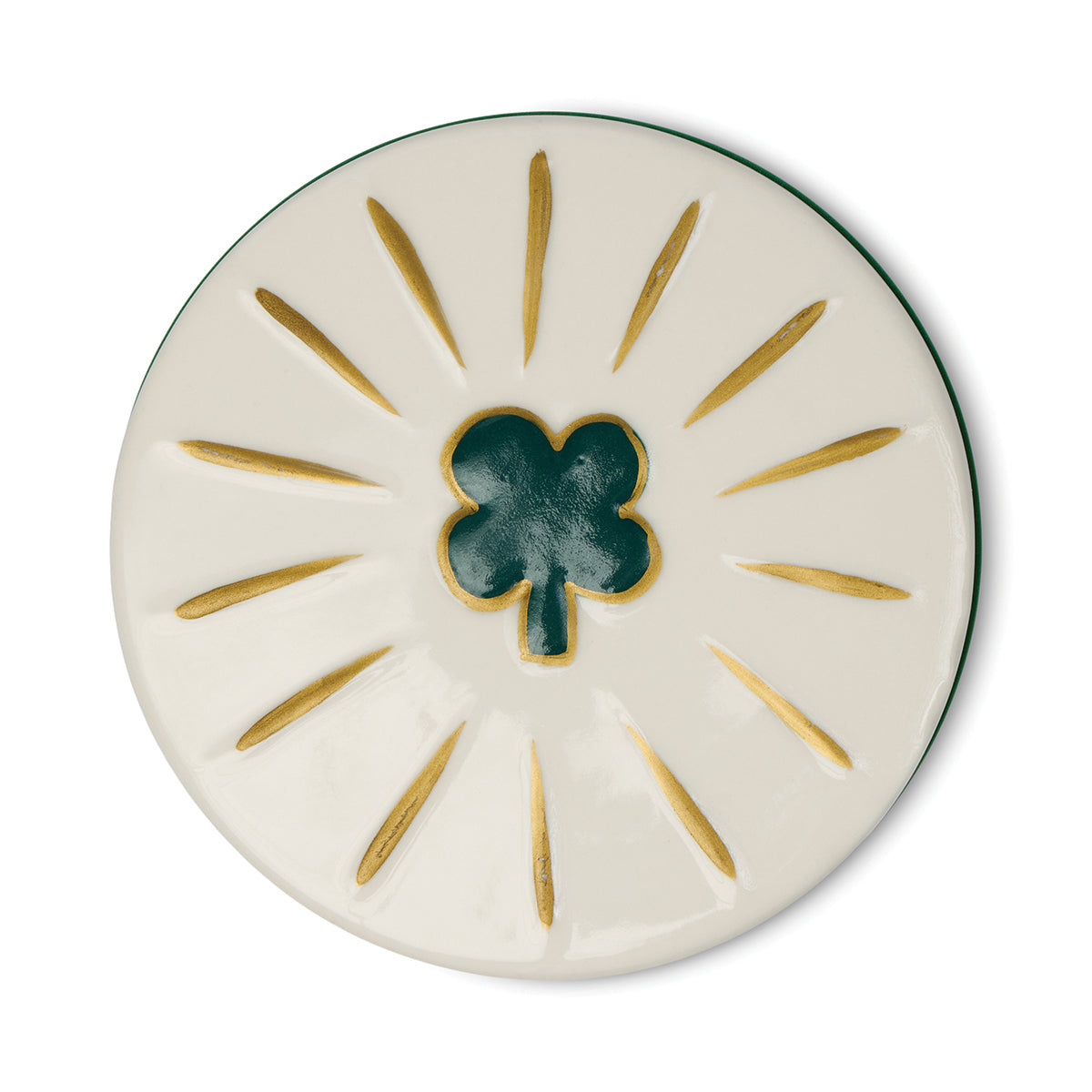 Round ceramic coaster with a green clover design on a white background