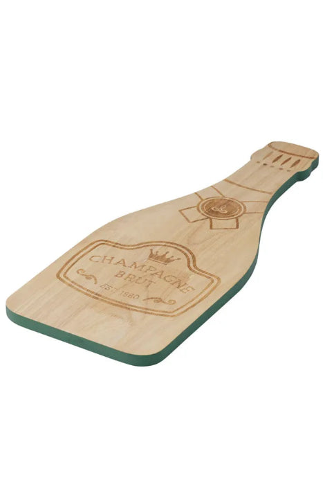 A champagne bottle-shaped wooden cutting board with a natural wood grain top and a dark green base, featuring an engraved 'Champagne Brut' label design.