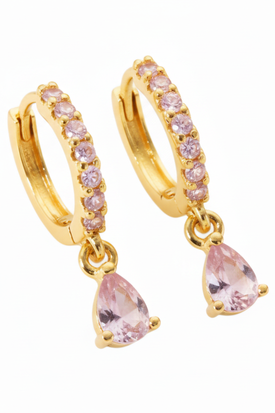 Gold hoop earrings with pink teardrop charms on a white background