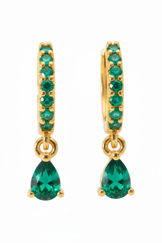 Gold hoop earrings with green gemstones on a white background