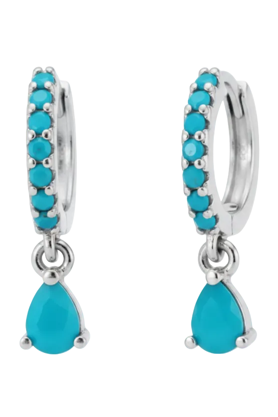 Turquoise hoop earrings with teardrop charms on a white background