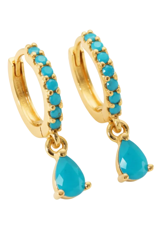 Gold hoop earrings with turquoise stones on a white background