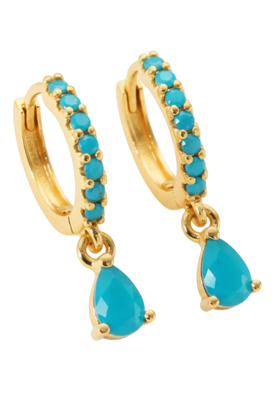 Gold hoop earrings with turquoise stones on a white background