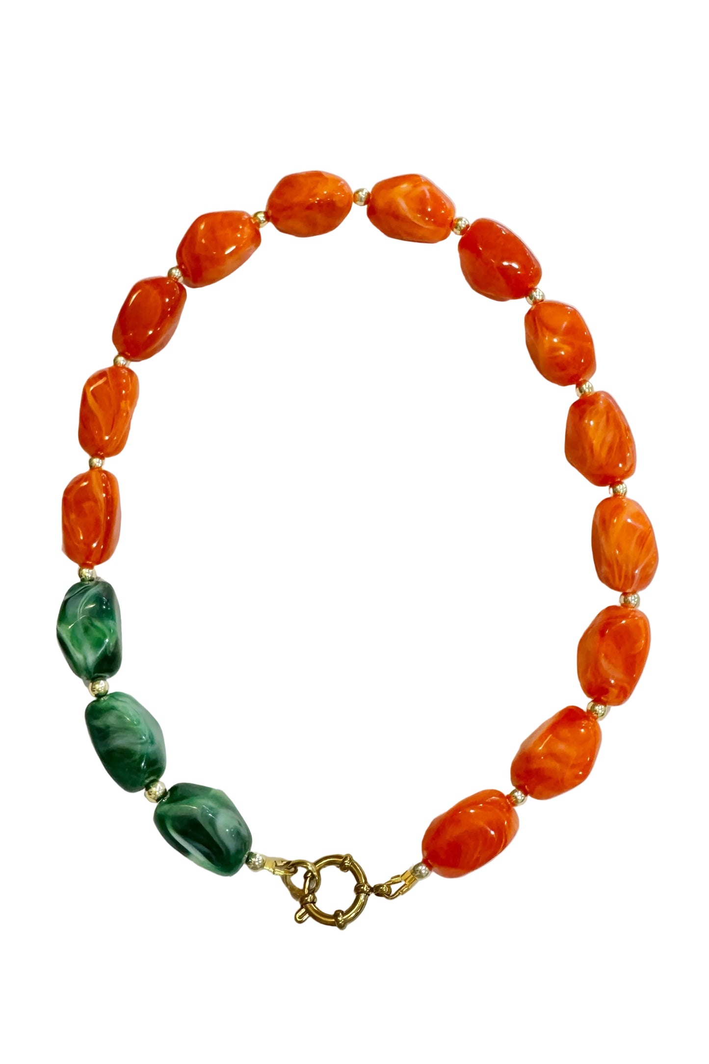 Necklace with orange and green beads on a white background