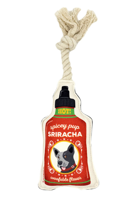 Dog toy designed like a Sriracha bottle with a rope handle on a white background