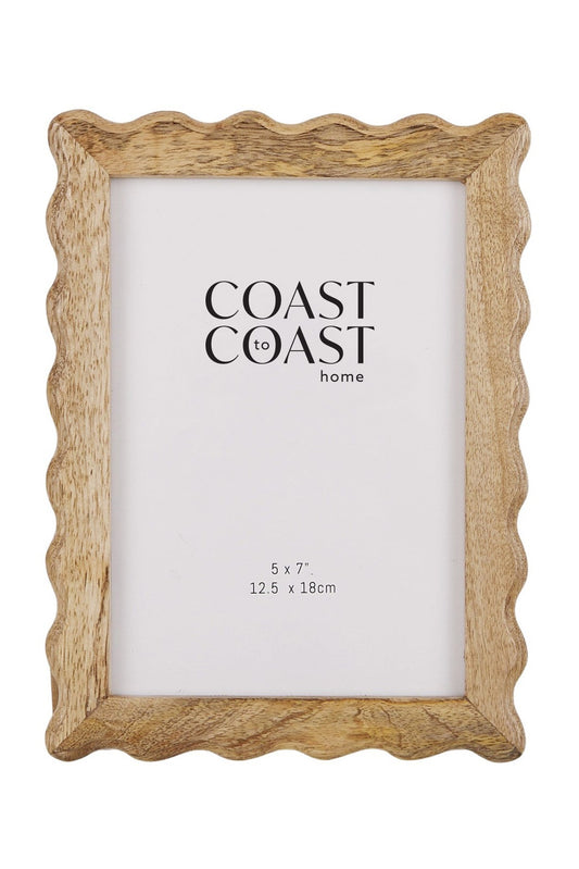 Wooden picture frame with scalloped edge and 'Coast to Coast Home' branding on a white background
