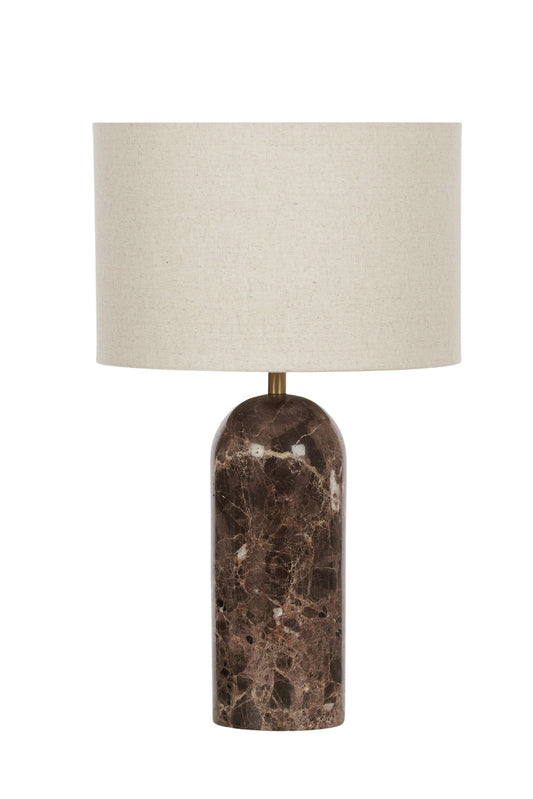 Table lamp with a marble base and beige shade on a white background