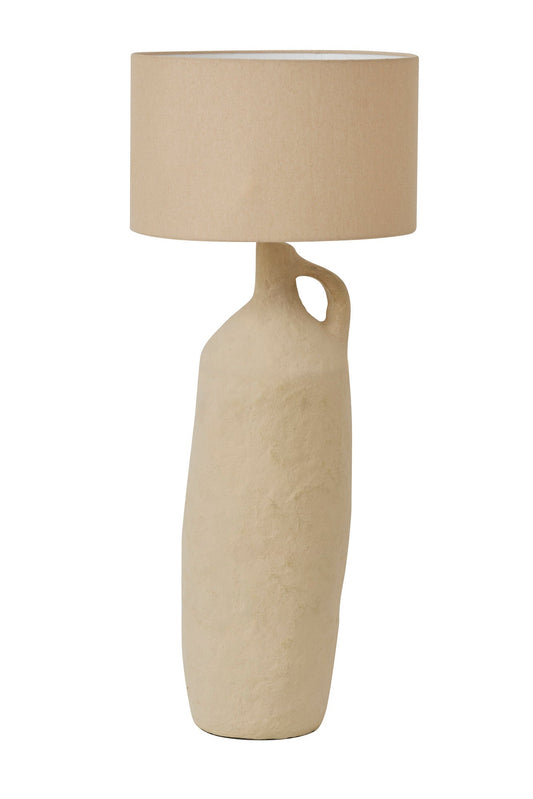 Beige floor lamp with a cylindrical base and round beige shade on a white background