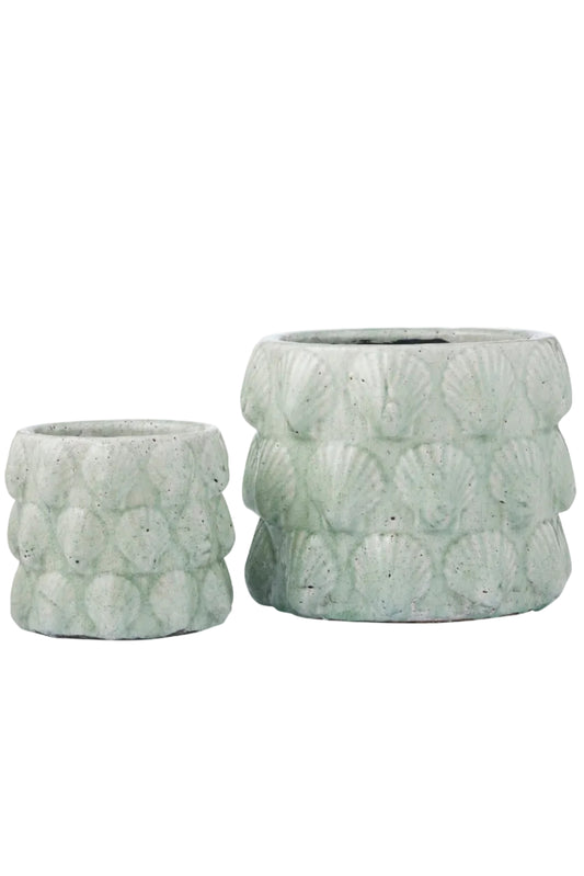 Two textured green planters on a white background