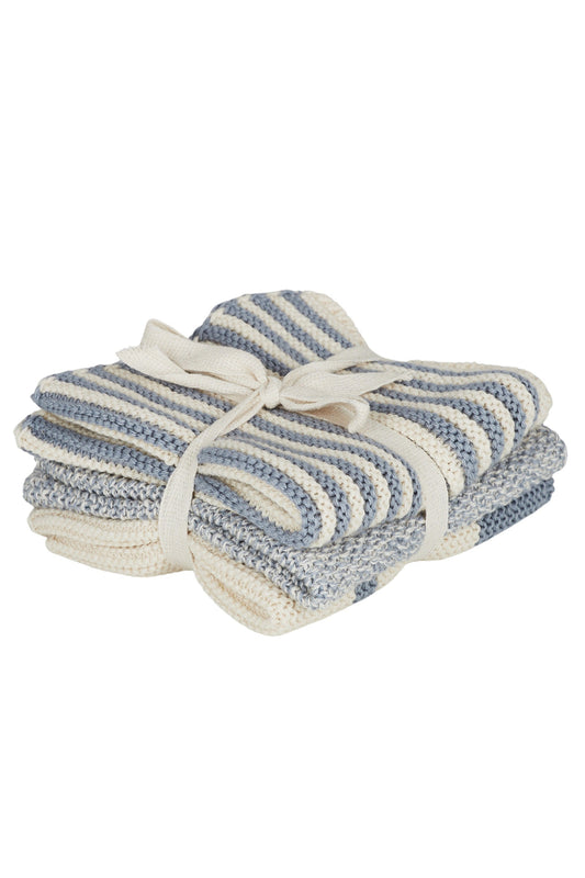 Stack of blue and white striped towels tied together on a white background