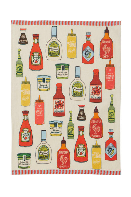 A rectangular kitchen towel or tea towel with a cream background, featuring a colorful retro pattern of various hot sauce, mustard, and dressing bottles. The towel has a red and white striped border at the top and bottom.