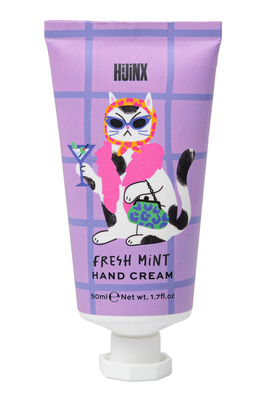 Hand cream tube with cartoon cat design on a purple background
