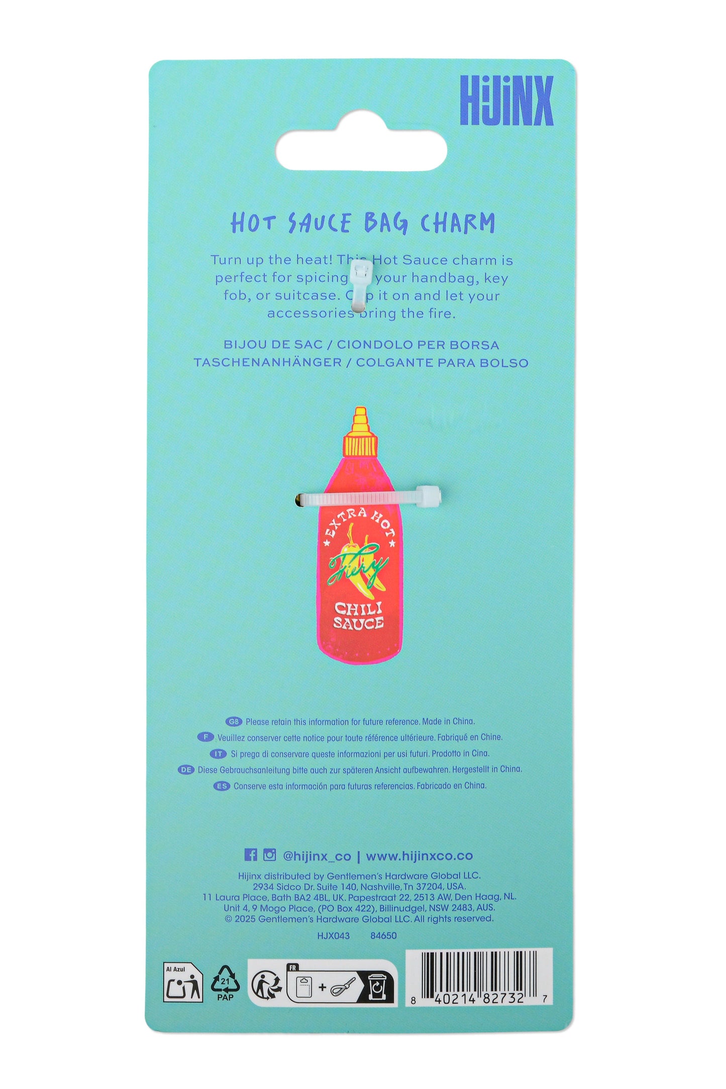 The back of a light blue retail card packaging for a HJINJX hot sauce bag charm, featuring a small red and yellow bottle charm with a metal clip.