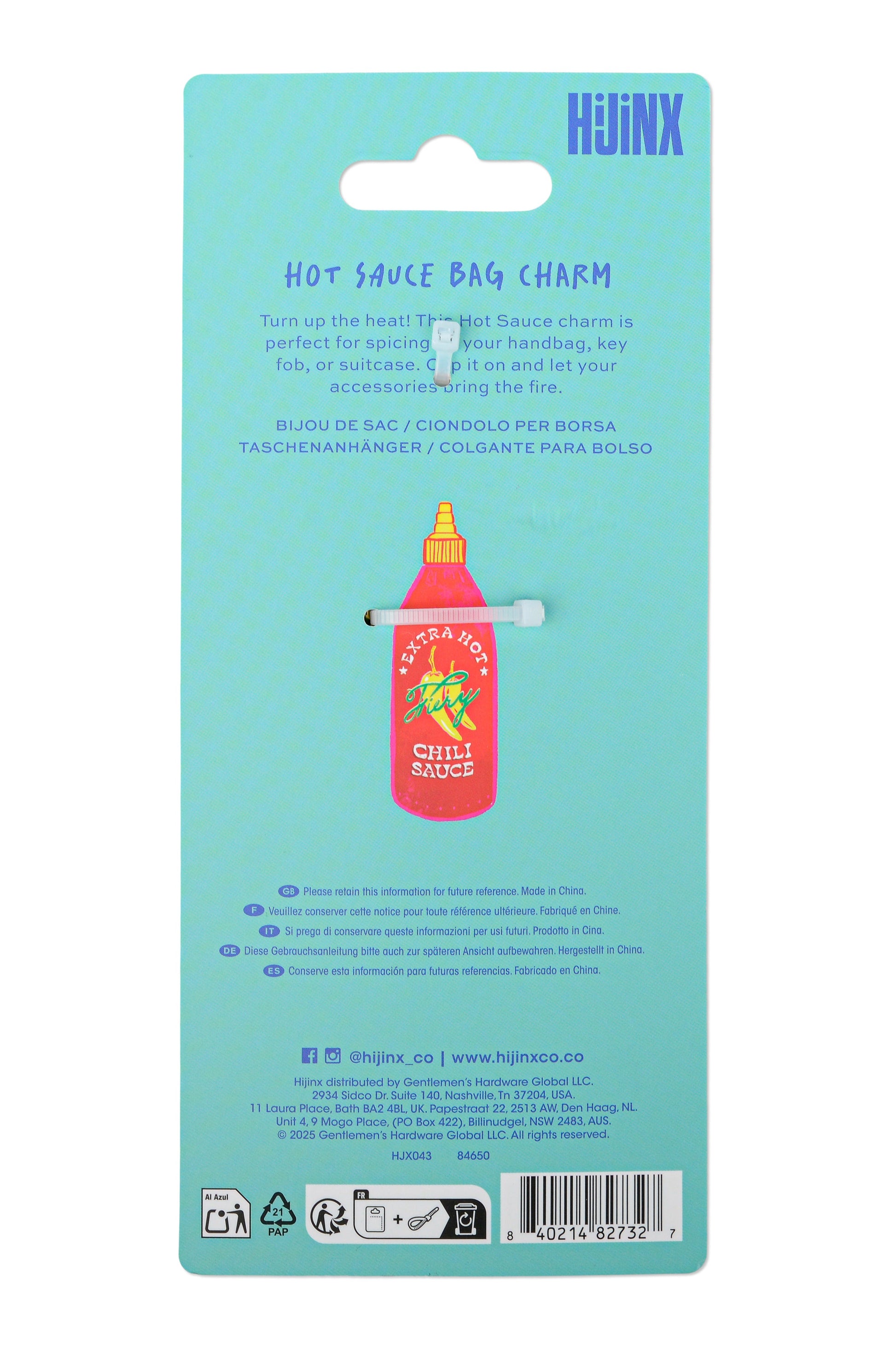 The back of a light blue retail card packaging for a HJINJX hot sauce bag charm, featuring a small red and yellow bottle charm with a metal clip.