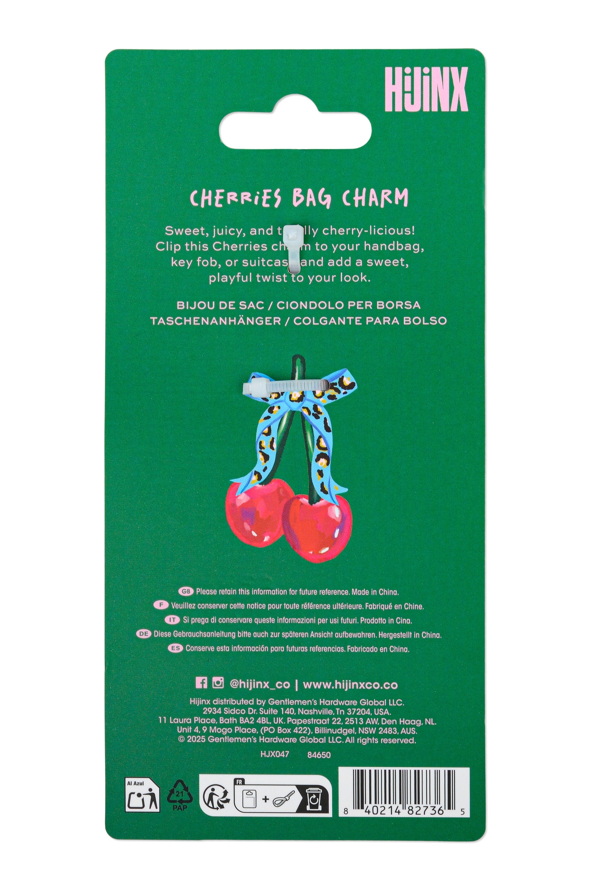 Green packaging for a cherry bag charm with text and branding.