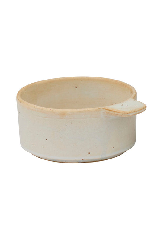 Two ceramic bowls, one beige and one brown, on a white background