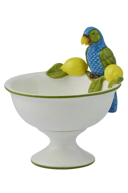 Decorative ceramic bowl with a parrot and lemons on a white background