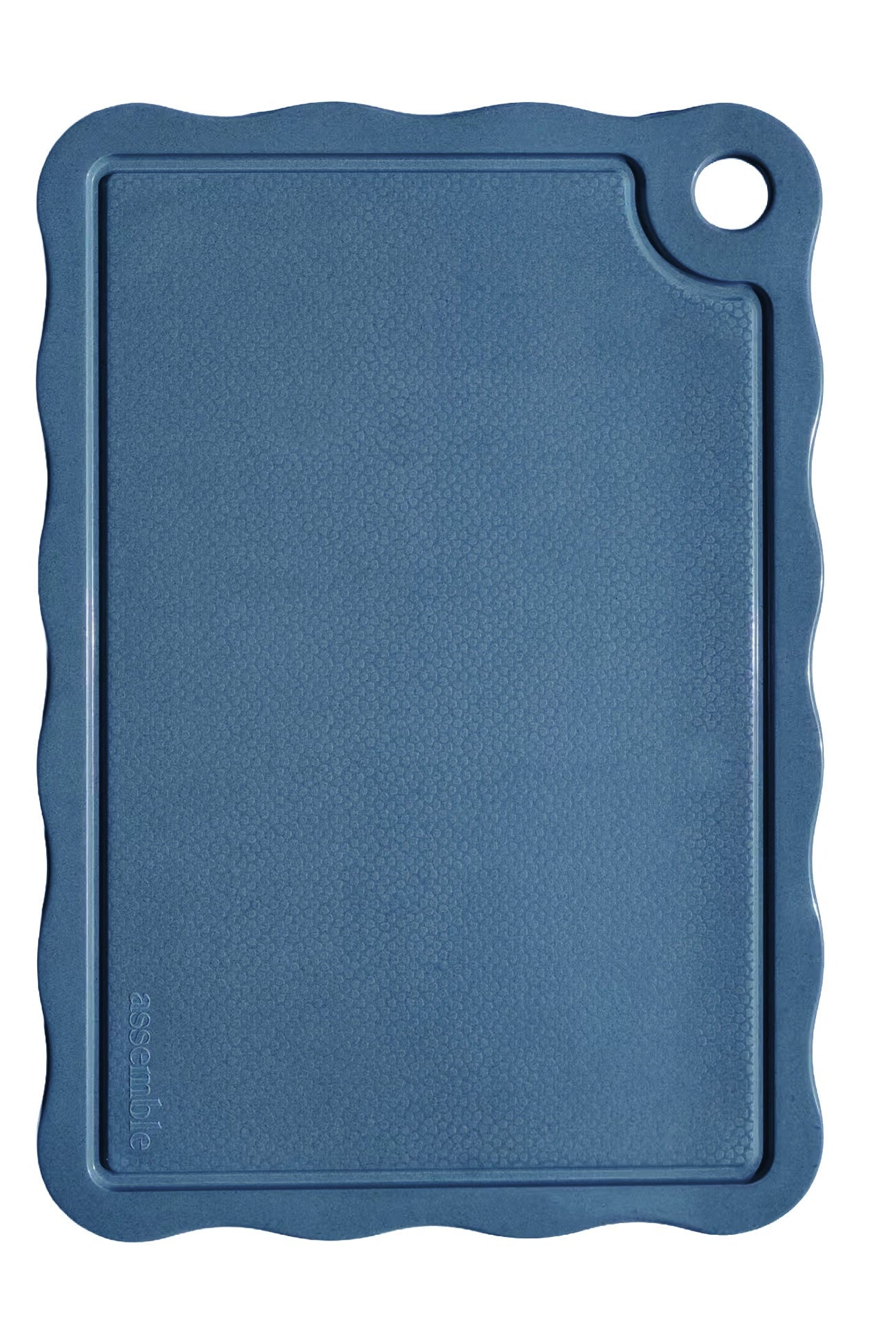 Blue cutting board with rounded corners on a light gray background