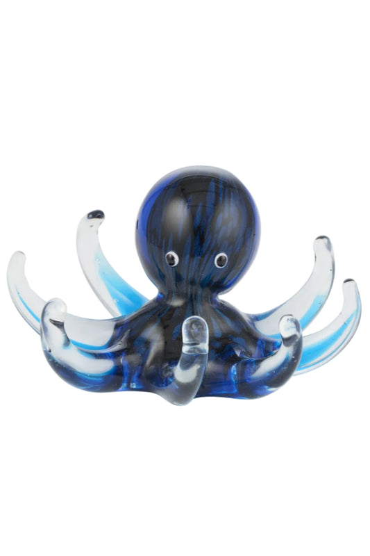 Glass octopus figurine with blue and black pattern on a white background