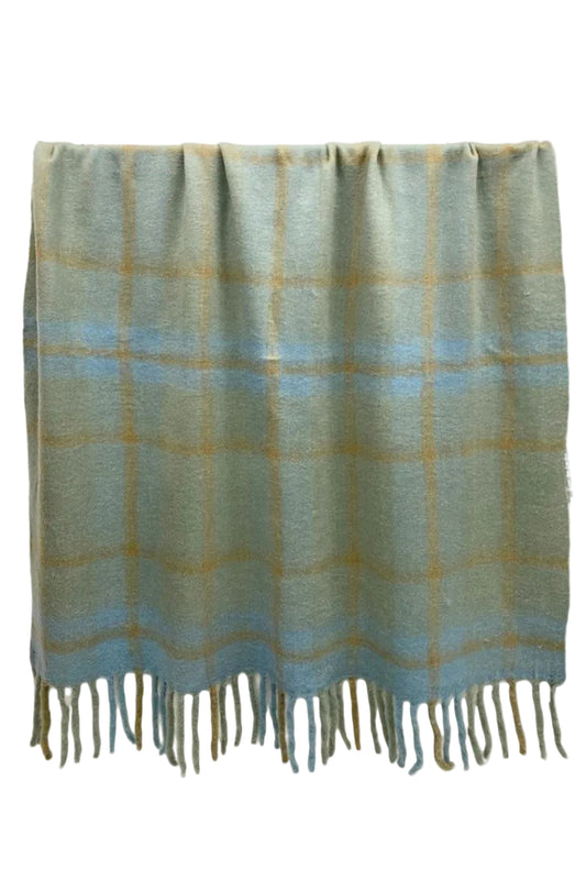 Plaid blanket with fringes on a white background