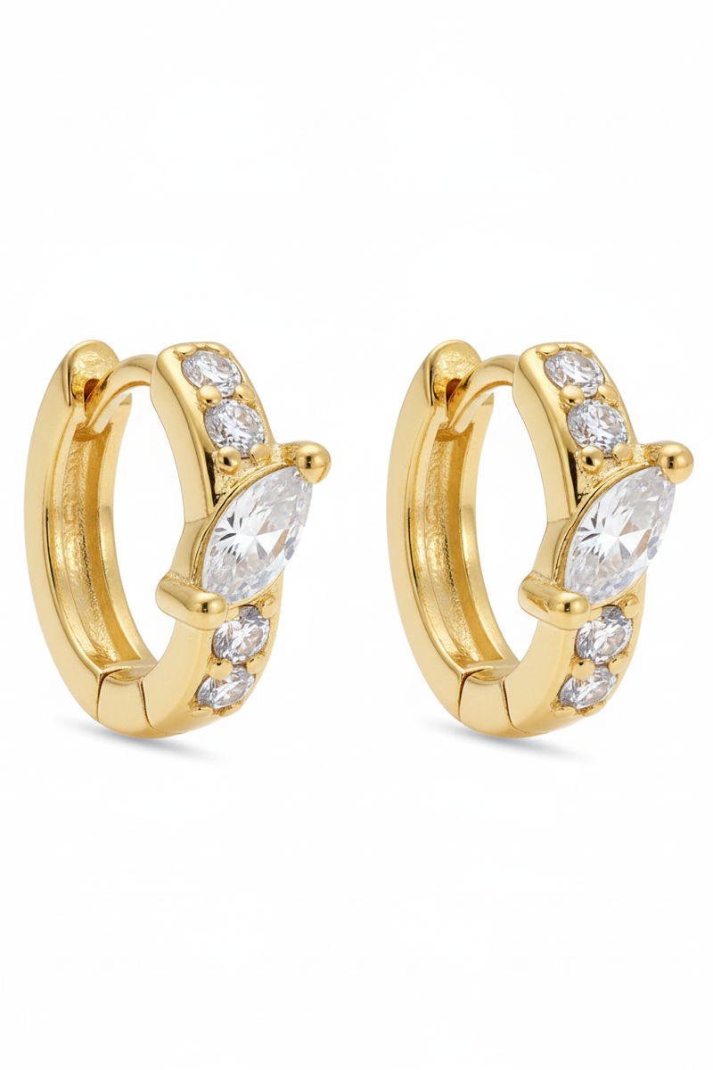 Gold hoop earrings with clear gemstones on a white background