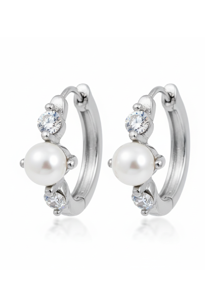 Pair of earrings with pearls and crystals on a white background