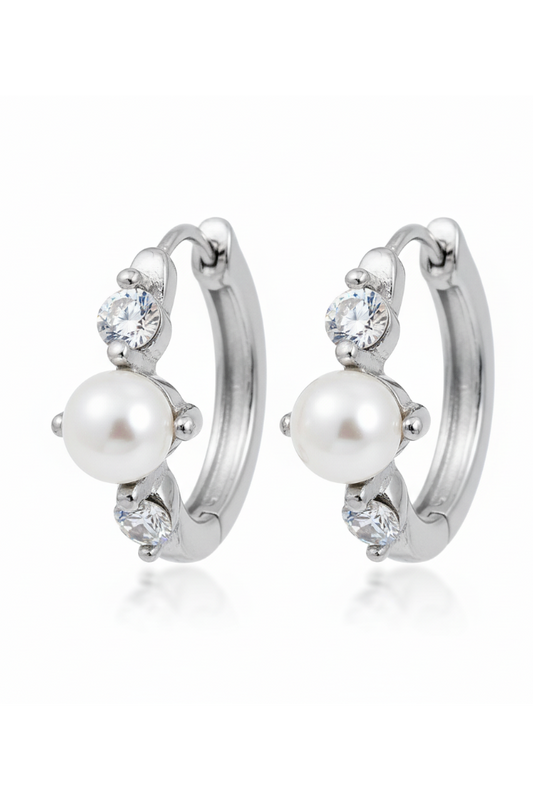 Pair of earrings with pearls and crystals on a white background